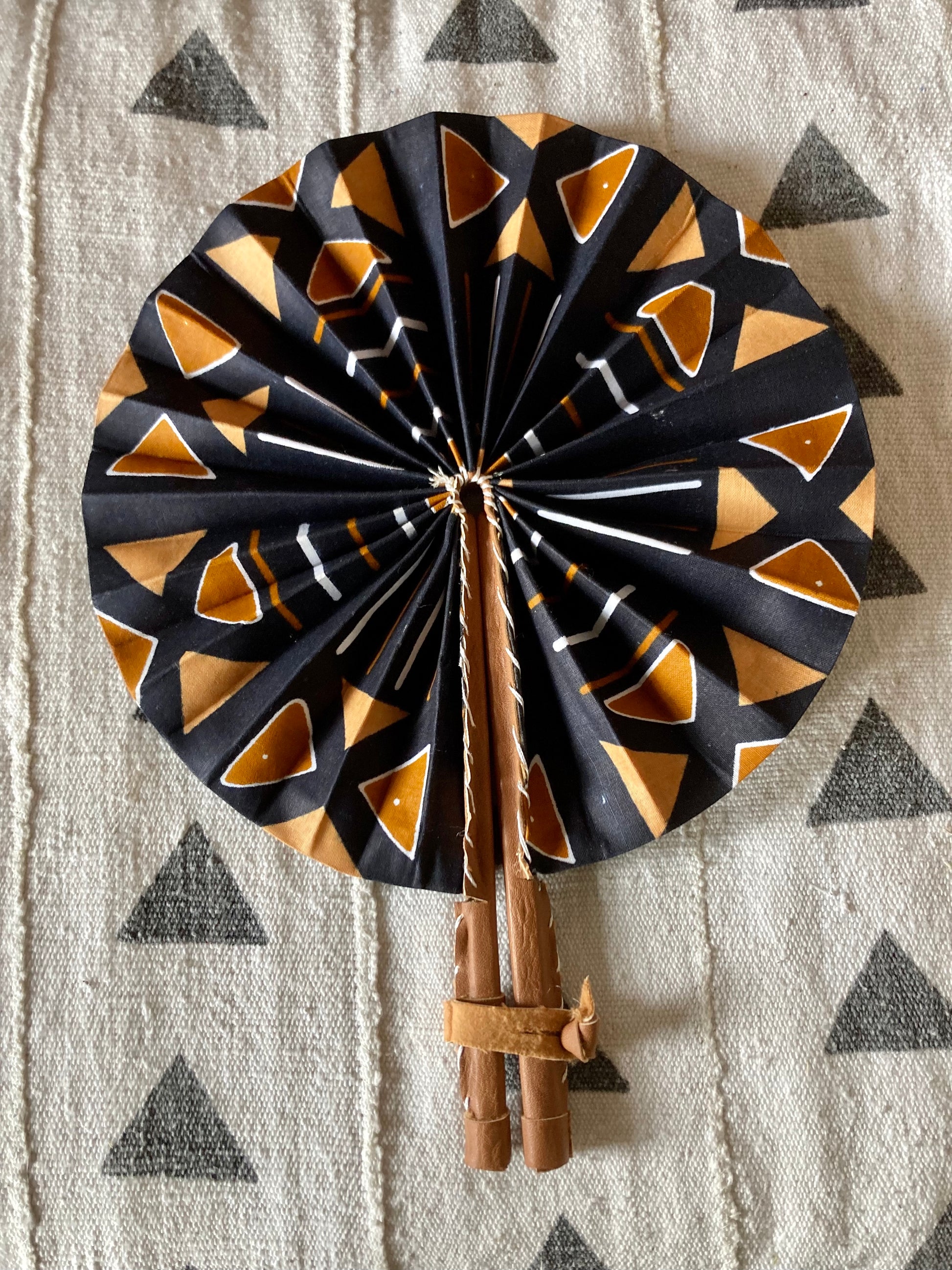 Fan- Collapses for easy storage, made from African wax fabric