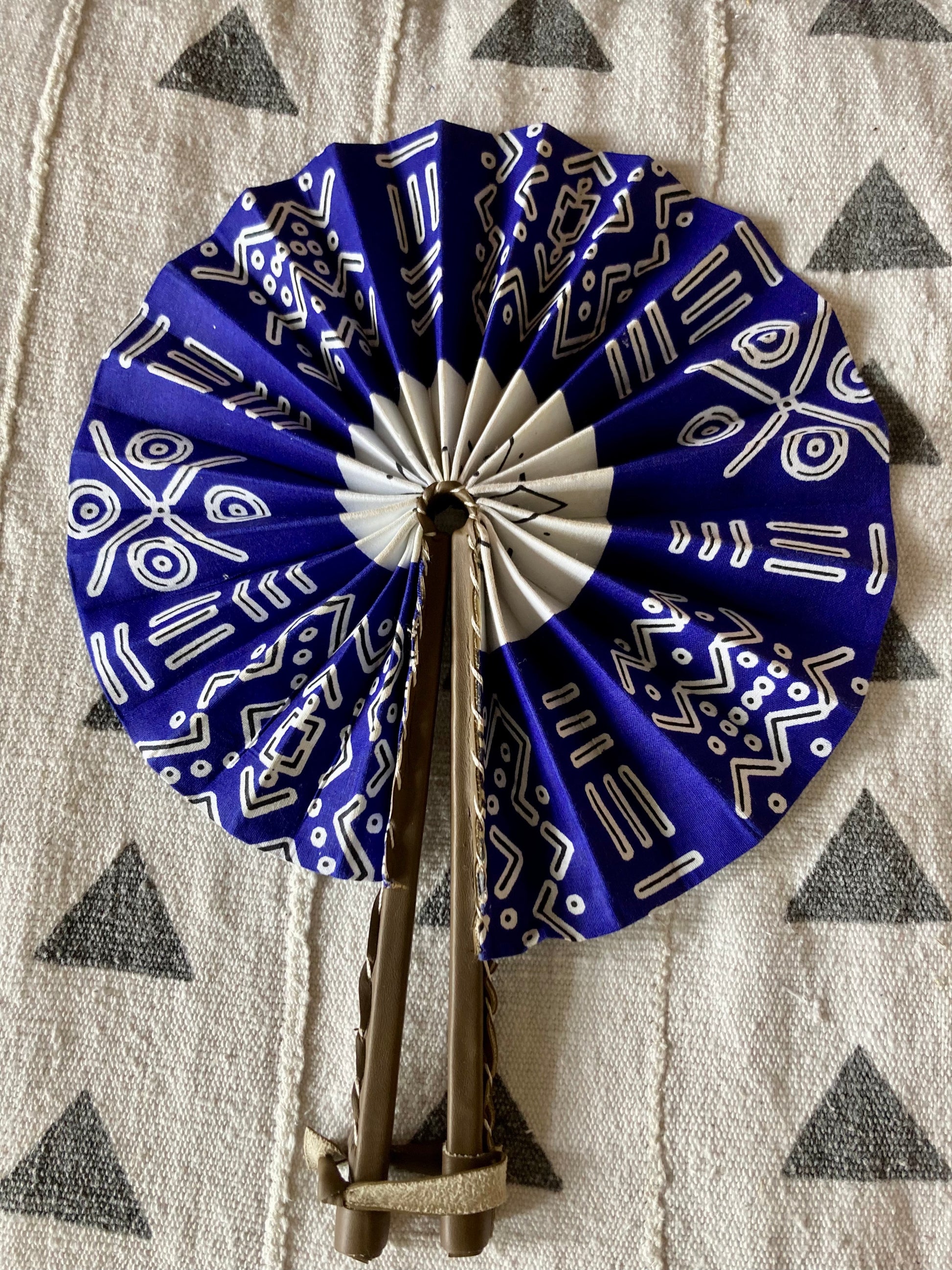 Fan- Collapses for easy storage, made from African wax fabric